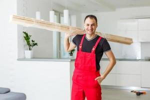 Handsome young carpenter in workshop photo