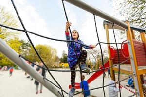 Active little girl on playground photo