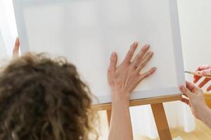 Woman drawing with her palm to create modern artwork photo