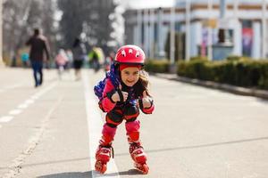 Young happy skater trying exciting outdoor activity. photo