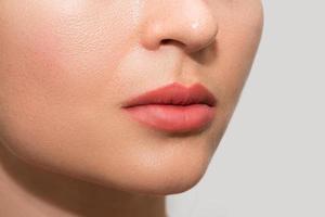 Female lips after permanent makeup lip blushing procedure photo