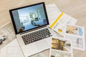 Workplace of architect - notebook, calculator, construction drawings on grey background photo