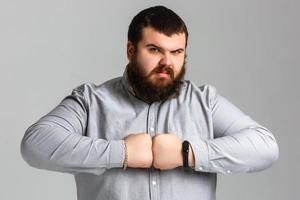 Emotional portrait of muscular aggressive man photo