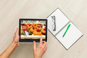 man tablet with app delivery food screen photo