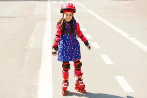 Young happy skater trying exciting outdoor activity. photo