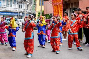 12 December 2018  Chinese kid dancer theater group dancing in Chinese respect the gods celebration of Lampang city before the Chinese New Year on February. photo