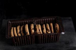 Chocolate chip cookies on black background photo