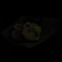 cake in a banana leaf container on a black background photo