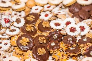 different tasty christmas cookies with nuts chocolate and marmelade photo