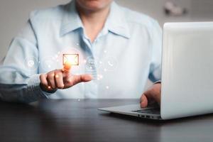 Businesswoman using laptop and touching on virtual screen contact icons such as email, address, live chat, internet wifi.Contact us or Customer support hotline people connect. Connect with cyberspace. photo
