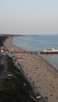 Aerial Footage of British Sandy Beach and Ocean. Vertical and Portrait Style 4k Footage of Bournemouth Beach with Drone's Camera During Sunset video