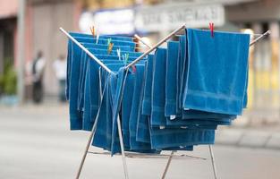 neatly folded towels drying outside drying in the open air. photo