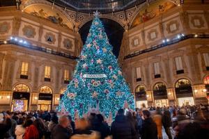 Italy 2022 Illuminated christmas tree at the entrance to the vittorio emanuele gallery in Milan photo