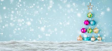 Empty white snow with blur Christmas tree baubles background photo