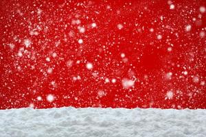 Empty white snow with snowfall on red background photo