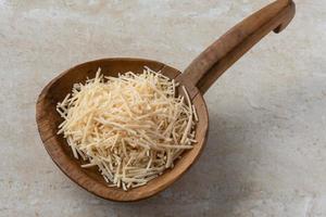 Shredded Parmesan on a Wood Paddle photo