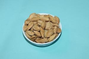 Different dried fruits and nuts on white background, top view. Space for text photo