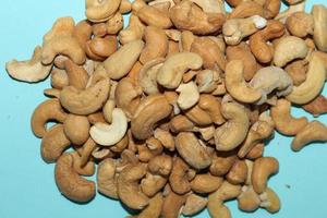Different dried fruits and nuts on white background, top view. Space for text photo