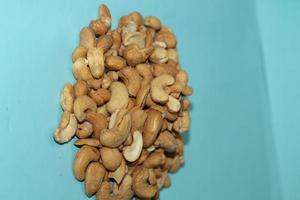 Different dried fruits and nuts on white background, top view. Space for text photo