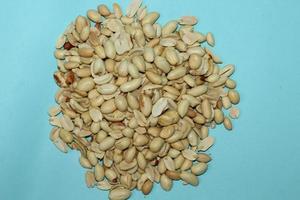 Different dried fruits and nuts on white background, top view. Space for text photo