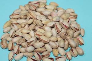 Different dried fruits and nuts on white background, top view. Space for text photo