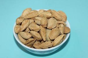 Different dried fruits and nuts on white background, top view. Space for text photo