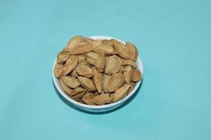 Different dried fruits and nuts on white background, top view. Space for text photo