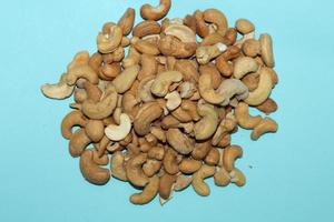 Different dried fruits and nuts on white background, top view. Space for text photo
