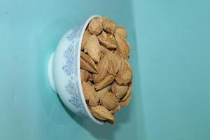 Different dried fruits and nuts on white background, top view. Space for text photo