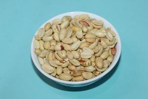 Different dried fruits and nuts on white background, top view. Space for text photo