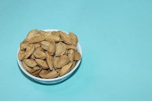 Different dried fruits and nuts on white background, top view. Space for text photo