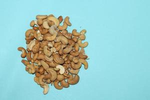 Different dried fruits and nuts on white background, top view. Space for text photo