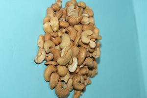 Different dried fruits and nuts on white background, top view. Space for text photo