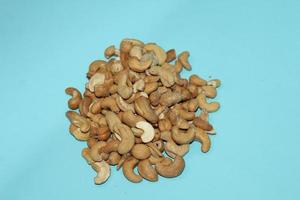 Different dried fruits and nuts on white background, top view. Space for text photo