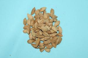 Different dried fruits and nuts on white background, top view. Space for text photo