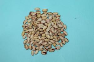 Different dried fruits and nuts on white background, top view. Space for text photo