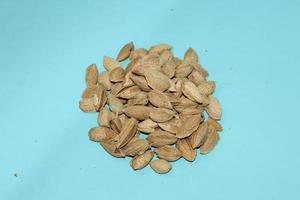 Different dried fruits and nuts on white background, top view. Space for text photo