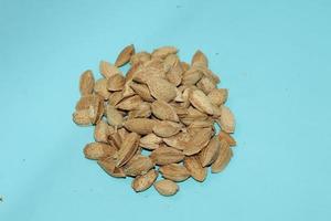 Different dried fruits and nuts on white background, top view. Space for text photo