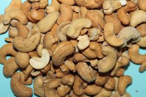 Different dried fruits and nuts on white background, top view. Space for text photo