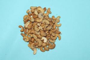 Different dried fruits and nuts on white background, top view. Space for text photo