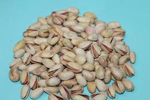 Different dried fruits and nuts on white background, top view. Space for text photo