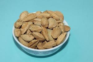 Different dried fruits and nuts on white background, top view. Space for text photo