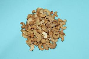 Different dried fruits and nuts on white background, top view. Space for text photo