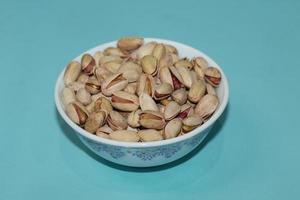 Different dried fruits and nuts on white background, top view. Space for text photo