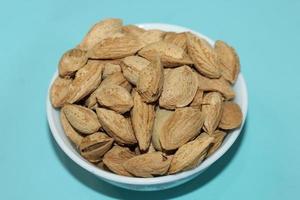 Different dried fruits and nuts on white background, top view. Space for text photo