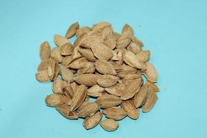 Different dried fruits and nuts on white background, top view. Space for text photo