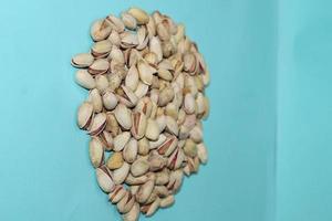 Different dried fruits and nuts on white background, top view. Space for text photo