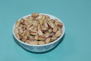 Different dried fruits and nuts on white background, top view. Space for text photo