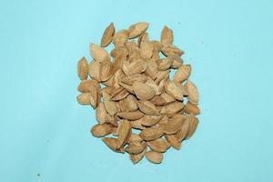 Different dried fruits and nuts on white background, top view. Space for text photo