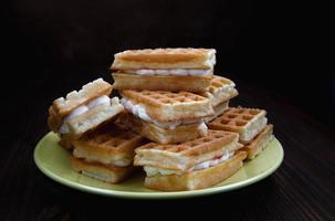 Viennese waffles on a yellow plate. Plate with waffles. photo